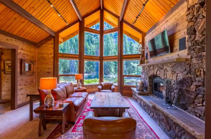 A cozy lounge area with expansive windows at Triple Creek Ranch, Montana