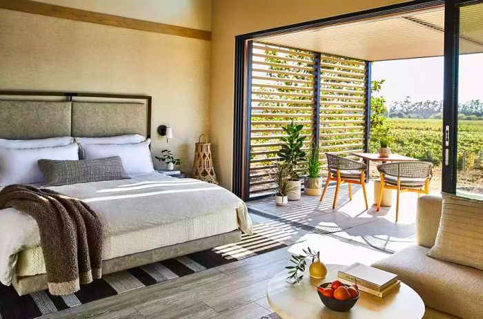 A guest room featuring patio seating at Stanly Ranch, Auberge Resorts Collection