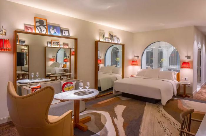 Guest room featuring multiple mirrors and artistic prints at Lotte Hotel Seattle