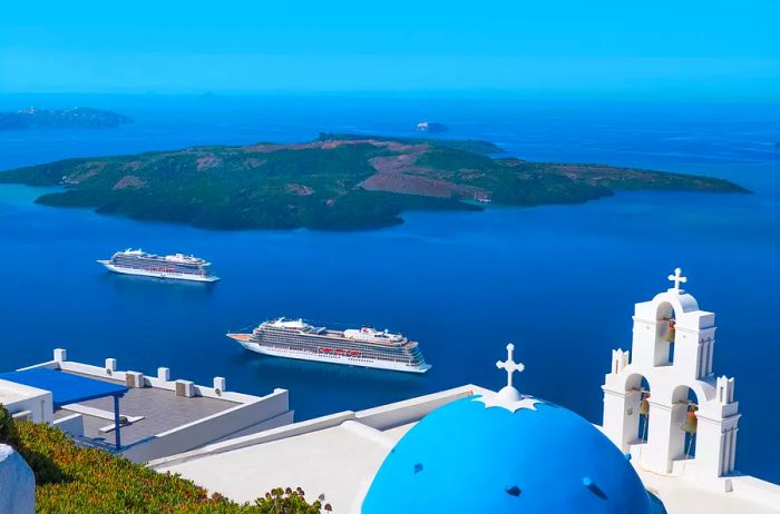 View of the Viking Star and Viking Sea cruise ships from Santorini, Greece.