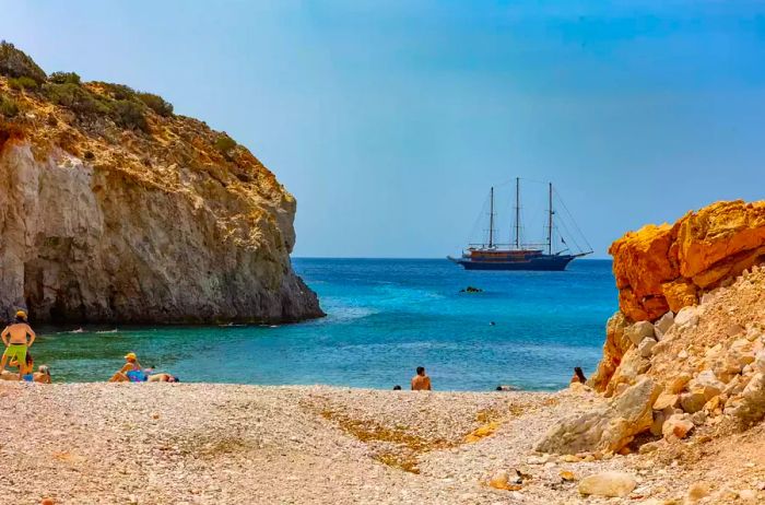 A Variety cruise ship anchored off the Greek coast with sunbathers onboard