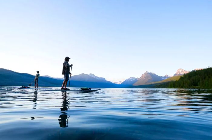 Individuals enjoying paddleboarding