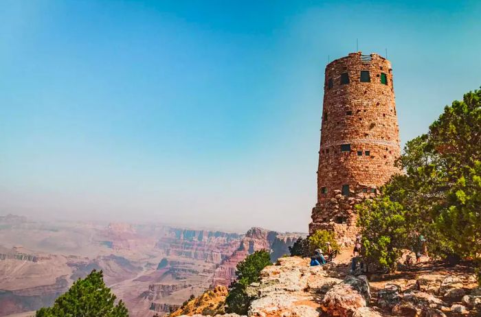 Visitors relaxing at the base of the Desert View Watchtower