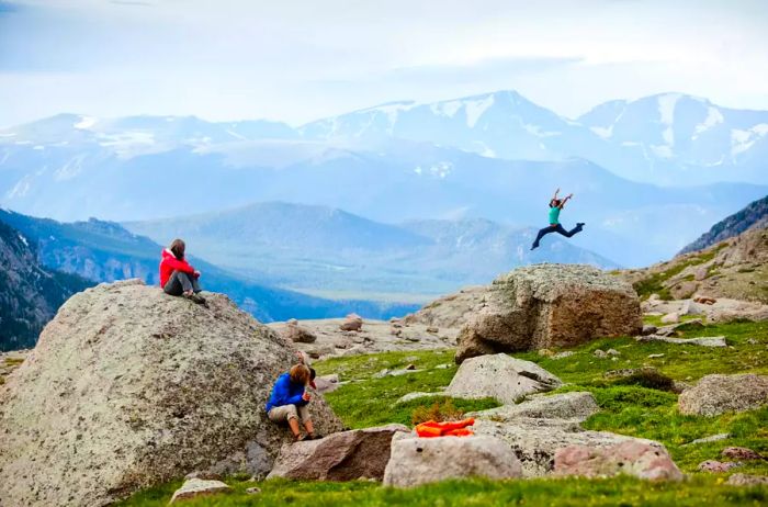 A woman leaping in Rocky Mountain National Park