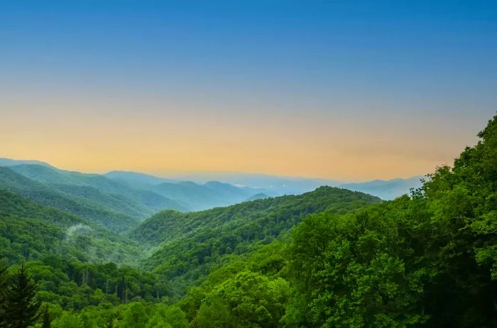 A picturesque sunset over the majestic Smoky Mountains adorned with vibrant skies