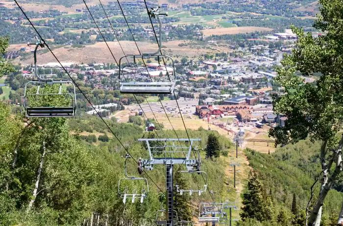 Park City, Utah ski lift among green trees