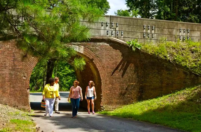 A group of women strolling through Ocmulgee National Monument Park