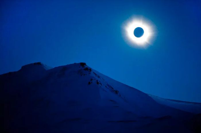 You can witness a total solar eclipse in Svalbard, Longyearbyen, Norway.