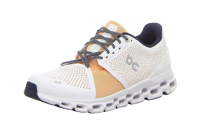 white and brown cloud sneakers