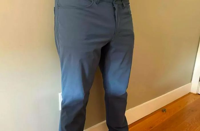 A person is seen wearing the Lululemon ABC Classic-Fit Pant Warpstreme