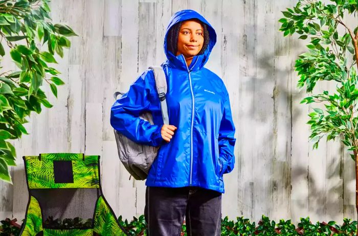 A person wearing the Columbia Women's Switchback III Jacket outdoors