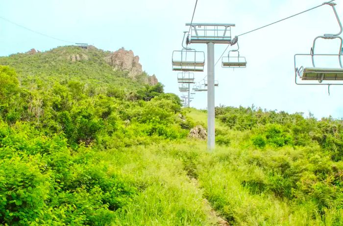 A chairlift ascending a mountain in St. Martin.