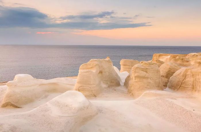 Explore the volcanic rock formations at Sarakiniko beach on Milos island, Greece.