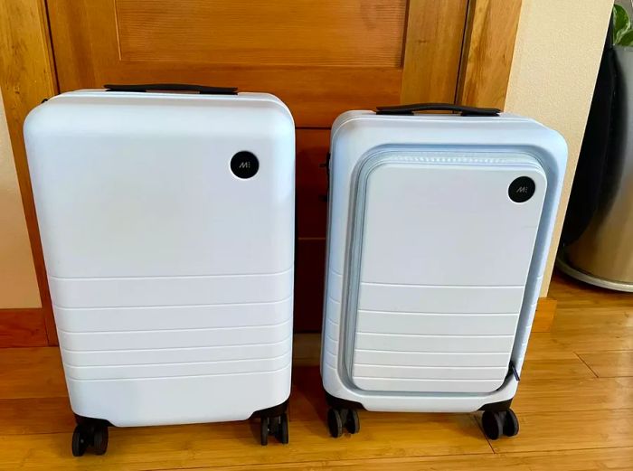 Monos Carry-on Pro resting on a wooden floor