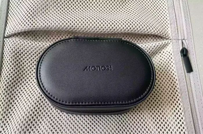 Monos Travel Jewelry Case closed and placed on a suitcase