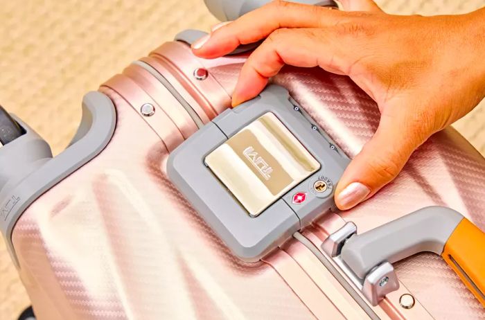 A close-up view of the lock on the TUMI 19 Degree Aluminum International Carry-on