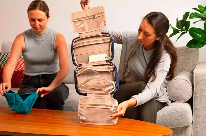 Two women opening different toiletry bags