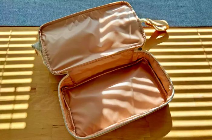 An open Beis The Dopp Kit travel pouch showcasing its contents