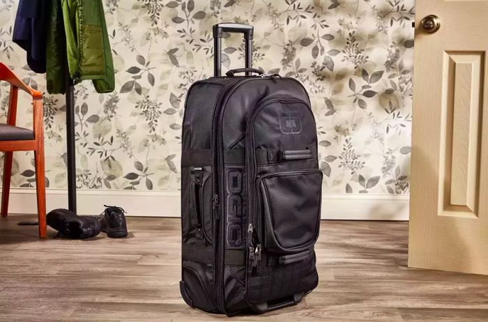 Ogio Terminal Travel Bag showcased upright against a floral backdrop