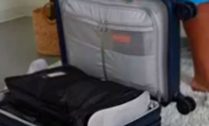 Another individual packs a suitcase using Béis packing cubes for organization.