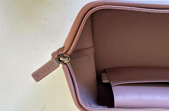 The zipper located at the top of the LINE+ARC The Medium  L Dopp Kit