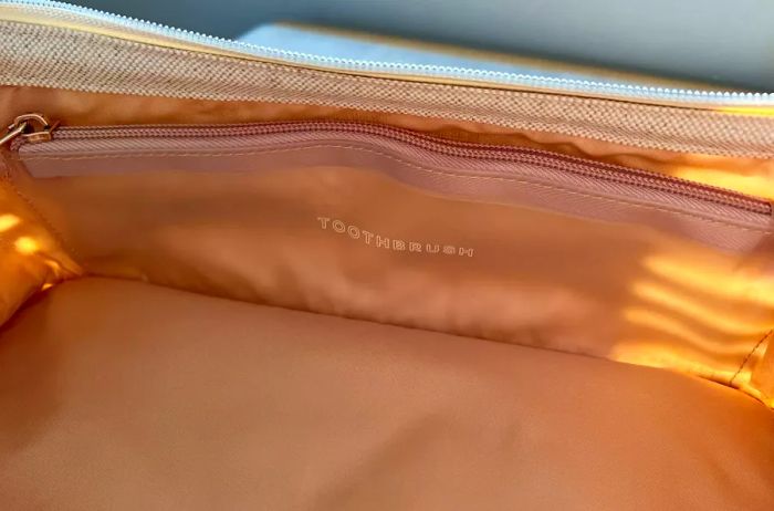 A close-up view of the inner pocket of a Beis The Dopp Kit travel pouch