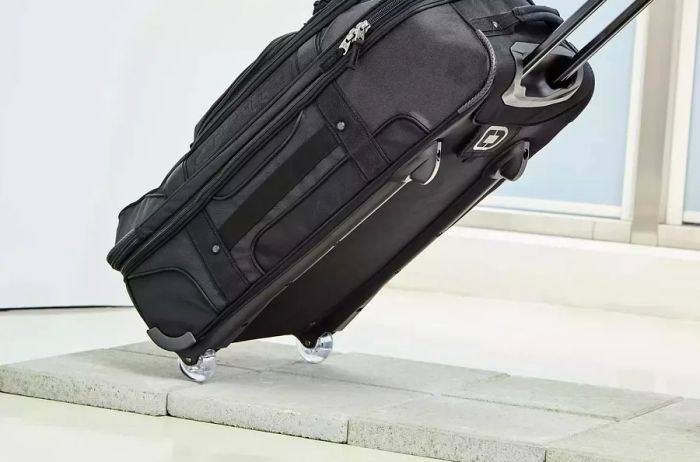 Ogio Terminal Travel Bag gliding over the pavement