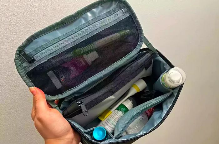 The Thule Subterra 2 Toiletry Bag filled with various toiletries