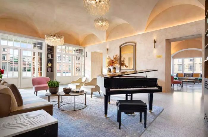 Lounge area featuring a grand piano in Grand Universe Lucca