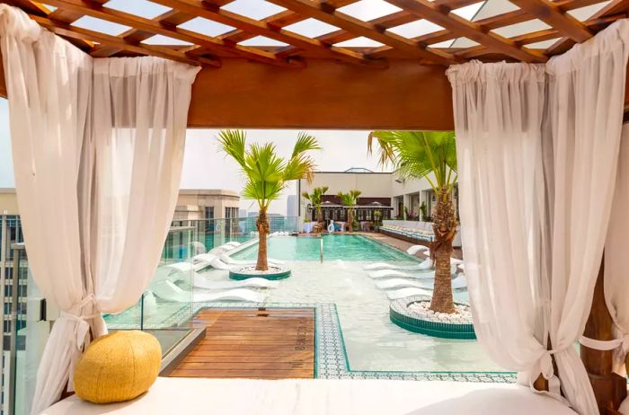 View from a private cabana overlooking the rooftop pool at Hôtel Swexan