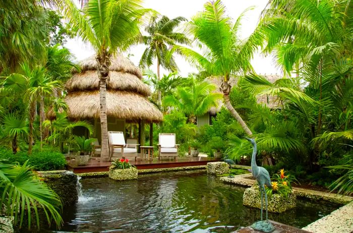 Enjoy seating that overlooks a beautiful garden fountain at Little Palm Island Resort & Spa