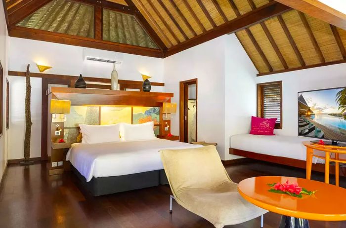 Interior view of an overwater bungalow at Sofitel Kia Ora Moorea.