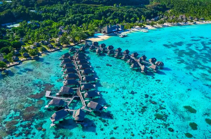 Aerial shot showcasing the overwater bungalows at Sofitel Kia Ora Moorea.