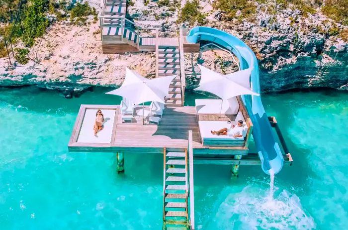 Aerial view showcasing the villa slide and sunbathing deck above the ocean at Wymara Villas in Turks and Caicos.