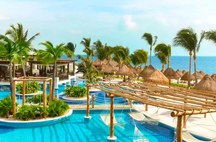 View of the pool area featuring hammocks.