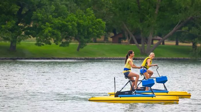 Women enjoying Hobie Pedal Boards at Lake Austin Spa in Texas.