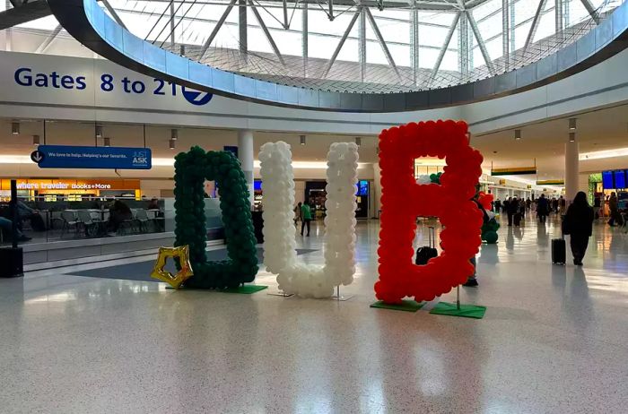 A vibrant balloon sign at JetBlue's terminal at JFK welcomes travelers to Dublin.