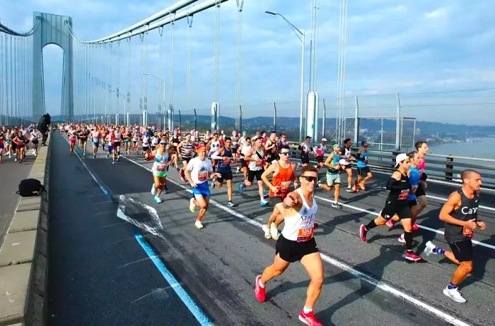 Runners dash across a bridge in New York City during the marathon