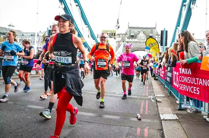 Runners crossing a bridge during the London Marathon.