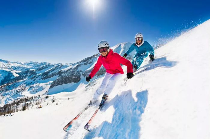 A young couple enjoying a ski day in the mountains of Salzburg, Austria