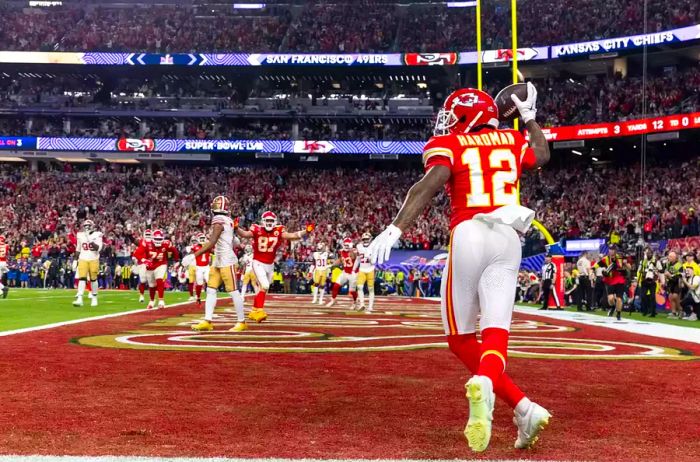 A football player celebrates after scoring a touchdown during the Super Bowl.