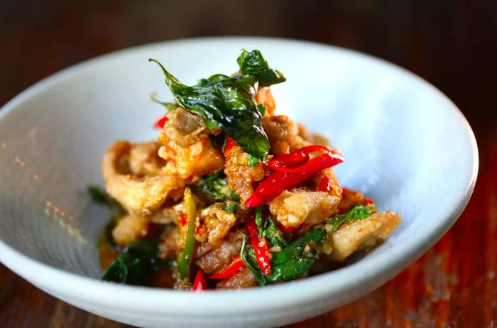 Crispy chicken with basil served at Spice I Am restaurant in Sydney, Australia