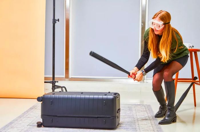 An individual striking the Away The Trunk with a baseball bat