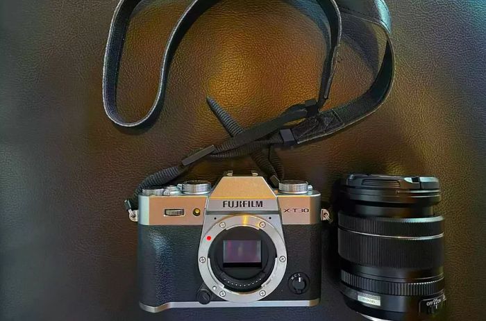 Fujifilm X-T30 II positioned on its side against a black backdrop