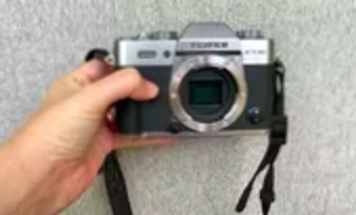 An individual holding the Fujifilm X-T30 II