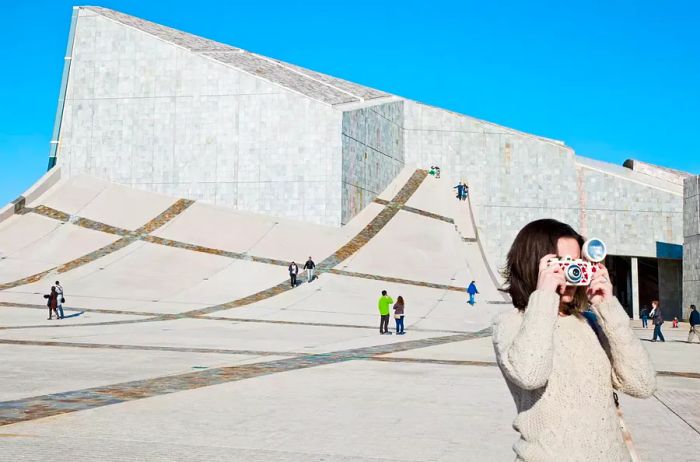 A woman captures a moment in Spain.