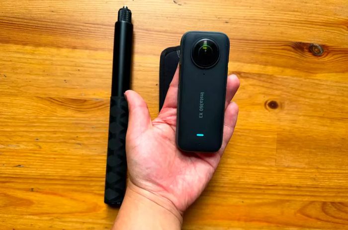 individual using the Insta360 x3 Selfie Stick