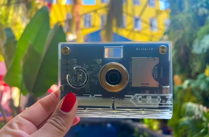 person holding a PaperShoot camera