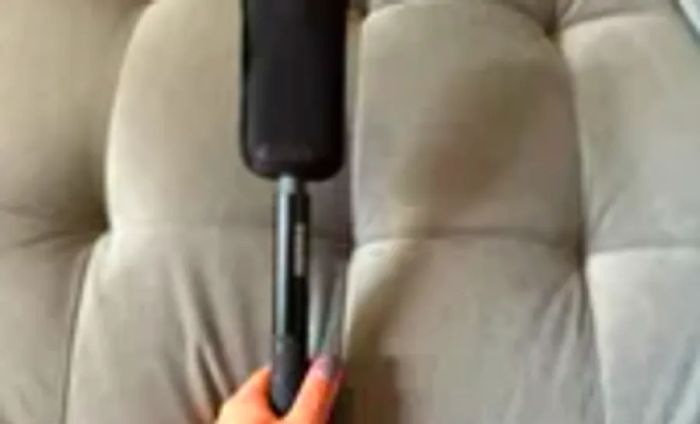 Insta360 x3 Selfie Stick resting on a couch