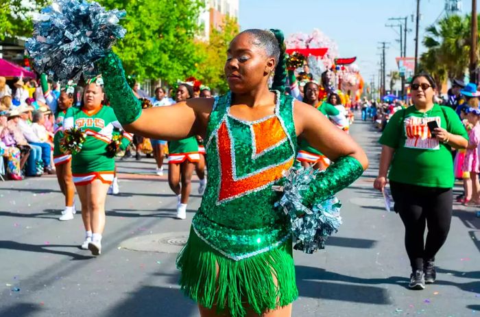 A dancer from Sam Houston High School performs during the Battle of Flowers Parade.